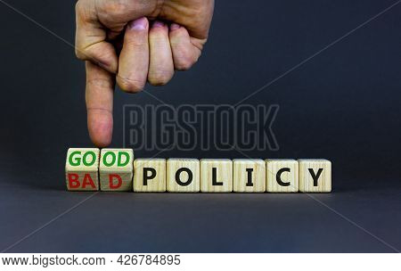 Good Or Bad Policy Symbol. Businessman Turns Wooden Cubes And Changes Words 'bad Policy' To 'good Po