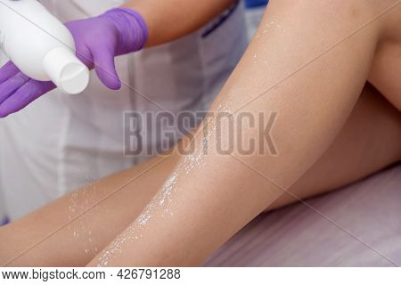 Cosmetic Procedure Applying Talcum On The Legs Depilation Epilation Rubbing Talcum Skin Softening