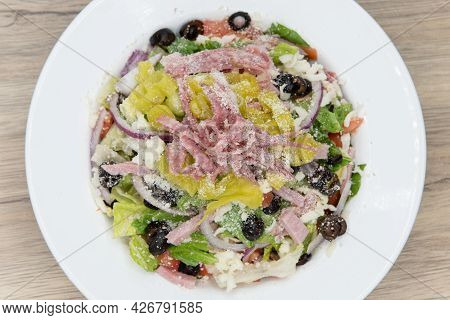 Overhead View Of Huge Bowl Of Antipasta Salad With All Fresh Vegetables Chopped And Piled High And C