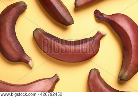 Tasty Red Baby Bananas On Yellow Background, Flat Lay