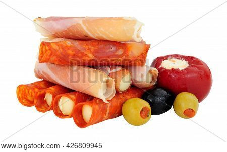 Group Of Serrano Ham And Chorizo Rollitos Filled With Gouda And Iberico Cheese Isolated On A White B