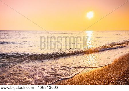 Soft Sea Ocean Waves Wash Over Golden Sand Background. Sunset, Sunise, Sun