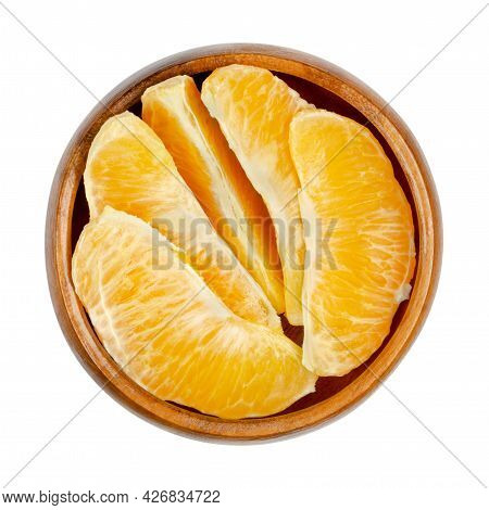 Orange Segments, In A Wooden Bowl. Segments Of A Peeled Valencia Orange. A Ripe And Sweet Fruit With