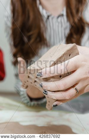 Women's Hands Knead Clay, Drawing Elements Of The Product. Production Of Ceramic Products At The Mas