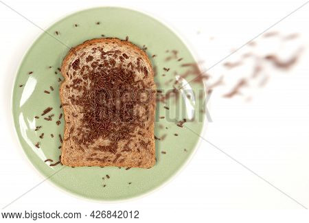 Typical Dutch Chocolate Sprinkles Falling (hagelslag), Used On Bread, Cake Or Desserts