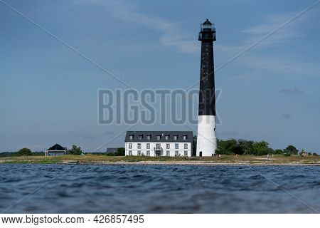 Sorvesaar, Estonia-06.21.2021: Lighthouse At The End Of Sorve Saar Peninsula. Tall Beacon Of Light F