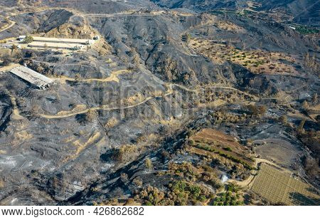 Mountain Fire With Burned Agriculture Land And Forest. Odou Village Cyprus. Disaster Of The Environm