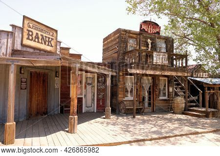 July 14, 2021 In Pioneertown, Ca:  Vintage Rustic Wooden Buildings On A Boardwalk Taken In Pioneerto