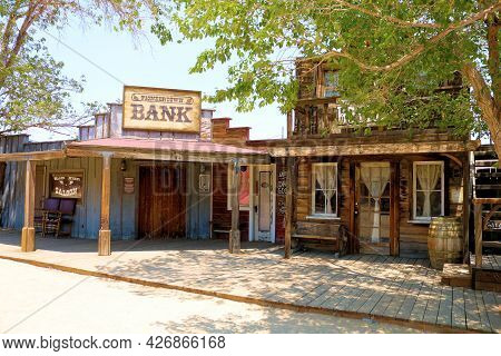 July 14, 2021 In Pioneertown, Ca:  Vintage Wooden Buildings On A Rustic Boardwalk Besides Cottonwood
