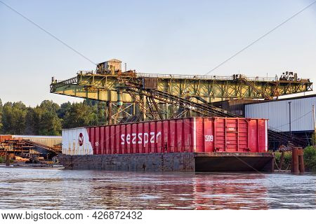 Surrey, Greater Vancouver, British Columbia, Canada - July 7, 2021: Container Barge Loaded At A Mill