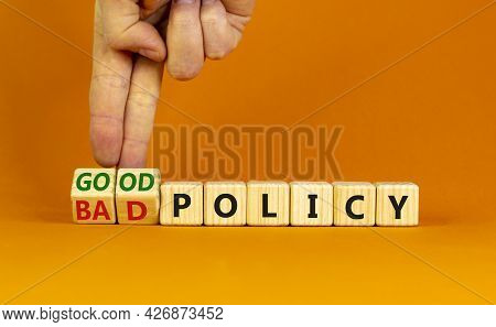Good Or Bad Policy Symbol. Businessman Turns Wooden Cubes And Changes Words 'bad Policy' To 'good Po