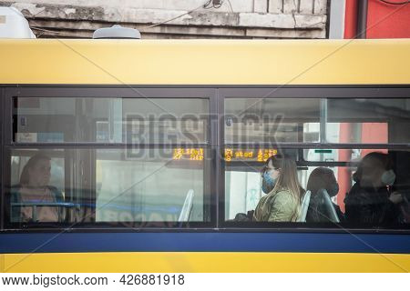 Belgrade, Serbia - June 1, 2021: Young Woman At The Window Of A Bus From Gsp Beograd Wearing A Respi