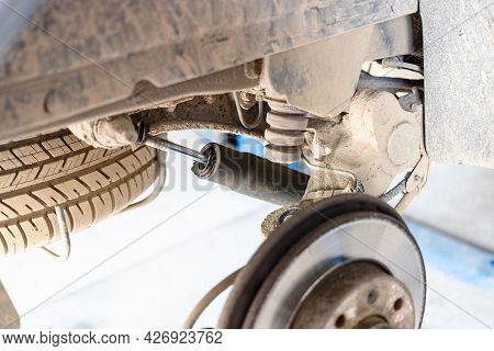 Broken Rear Shock Absorber On Old Car (focus On Car Shock Absorber Rod)