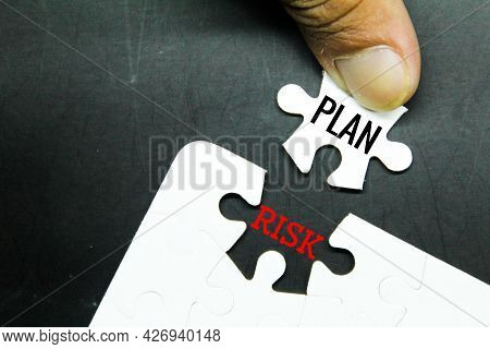 White Puzzle With The Words Plan And Risk