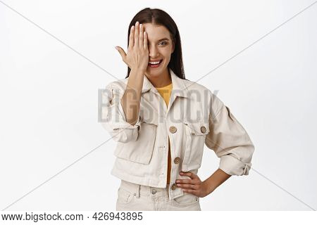 Beatiful Adult Woman Cover Half Of Face, One Eye Behind Palm, Smiling And Looking Confient, Wearing 