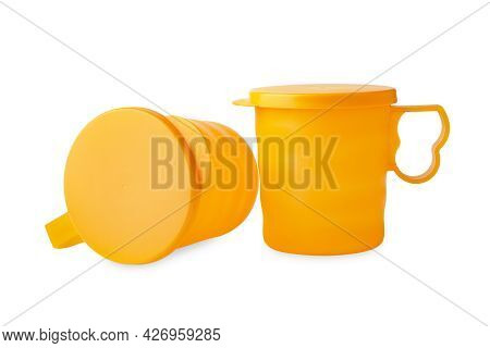 Plastic Tupperware Mugs. Two Plastic Yellow Mugs With Ergonomic Lid For Drinking, Storage And Transp