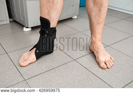 The Male Leg Is Fixed In A Medical Bandage. Ankle Fracture Or Sprain. Lacing And Tight Fit Of The Fo