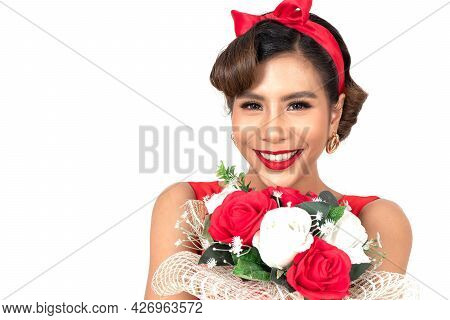 Beautiful Woman Toothy Between Red Tulips Flower, She Looks Freshy In Sexy Retro Style Fashion And R