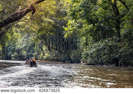 River Cruise Along Scenic Tahan River With Lush Rainforest Foliage At Taman Negara National Park, Pa