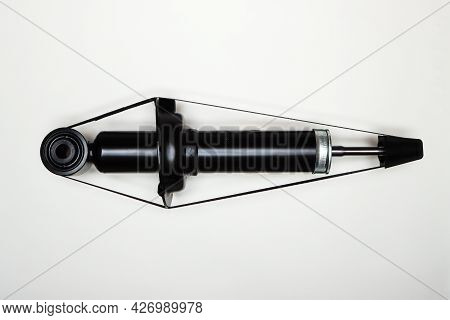One New Shock Absorber For The Car On A Flat Surface. A Set Of Spare Parts For The Repair Of The Cha