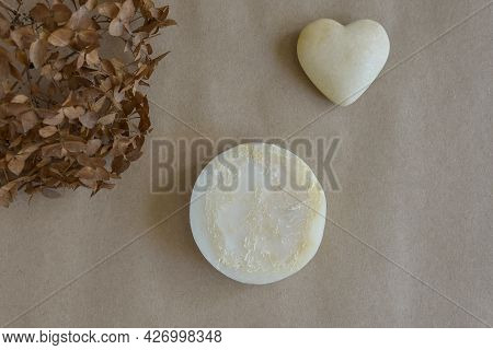 One Piece Of Round Natural Handmade Soap, Dry Flower Of Buldenezh And Souvenir Heart On Craft Paper.