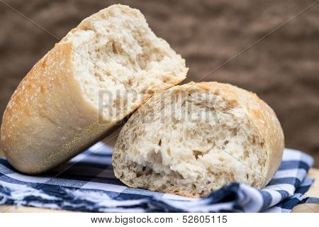 Loaf Of Sourdough Bread In Rustic Kitchend Setting