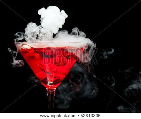 red cocktail with ice vapor