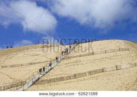 PYLA SUR MER, FRANCE - AUGUST 8: People visiting the Famous dune of Pyla, the highest sand dune in Europe, on August 8, 2012 in Pyla Sur Mer, France.