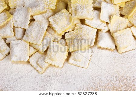 Italian pasta ravioli sprinkled with white flour