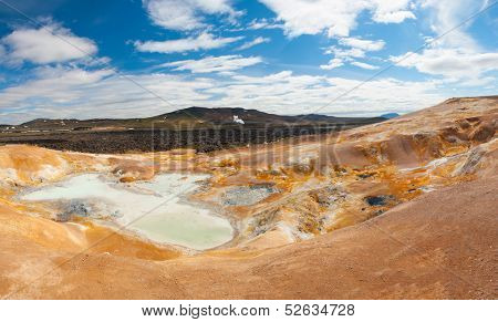 Leirhnjukur is the hot geothermal pool at Krafla area, Iceland. The area around the lake is multicolored and cracked.
