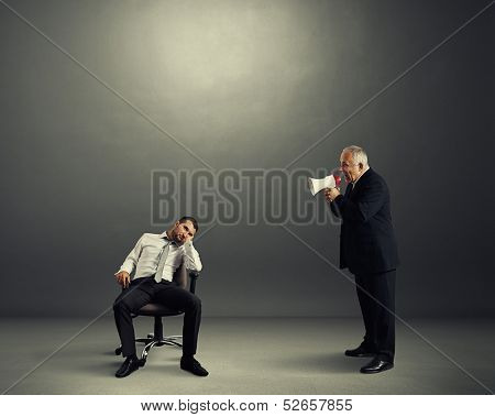 angry boss screaming at lazy worker