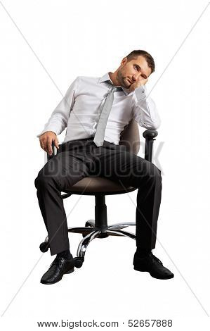 bored businessman sitting on the office chair. isolated on white background