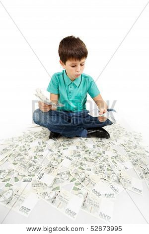 Boy Sitting On Money