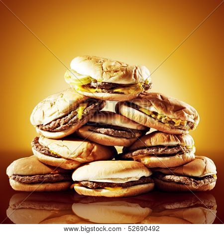 concept photo of a large pile of cheeseburgers