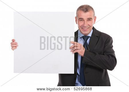 business man holding a blank pannel and smiling for the camera. on a white background