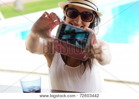 Beautiful Girl Taking A Selfie At The Swimming Pool.