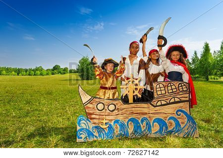 Happy diversity children as pirates with swords