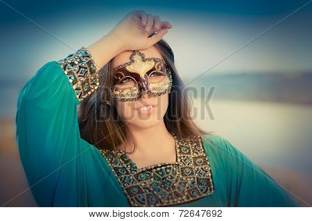 Young Woman Wearing Mask  and Oriental Dress