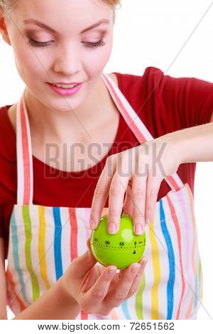 Happy Housewife Or Chef In Kitchen Apron Using Apple Timer