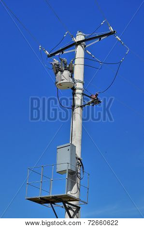 Distribution transformer on concrete power pole