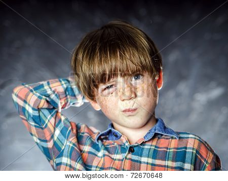 Emotional Portrait Of Red-haired Boy