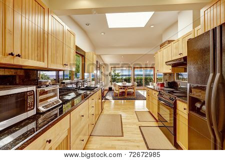 Empressive Kitchen Interior With Shiny Black Granite Tops