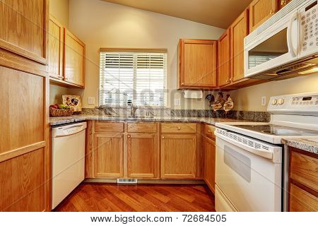Small Kitchen Area With White Appliances