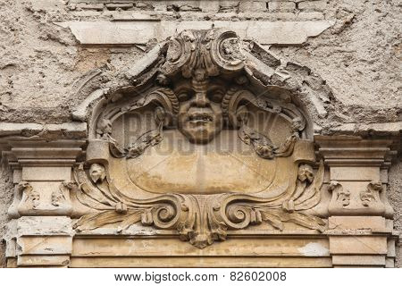 Funny mascaron on the Art Nouveau building in Prague, Czech Republic.