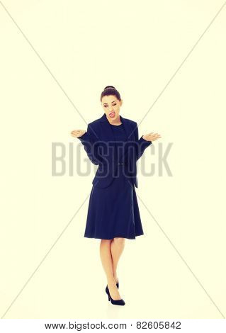 Anoyed and displeased businesswoman standing