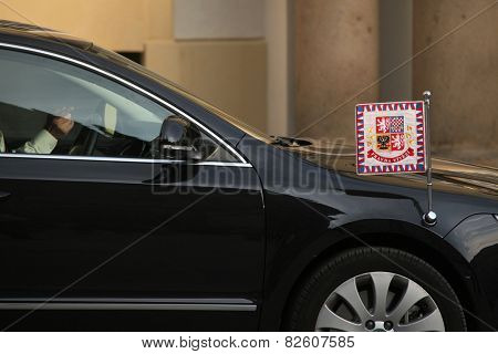 PRAGUE, CZECH REPUBLIC - MAY 9, 2013: Czech presidential limousine with a presidential standard drives ahead in Prague, Czech Republic.