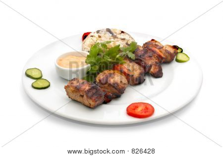 shish kebab with rice and mushrooms
