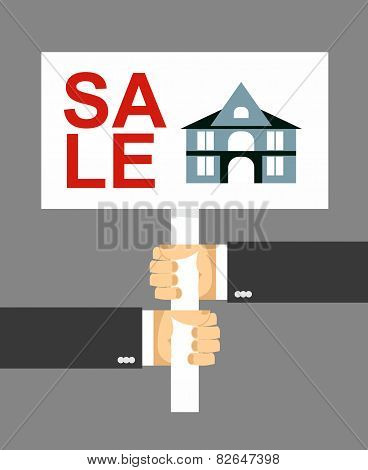 hands holding a sign.