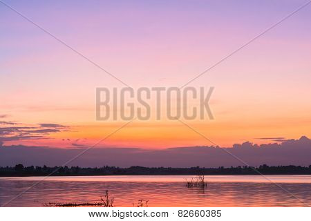 view of landscape with sunset on lake