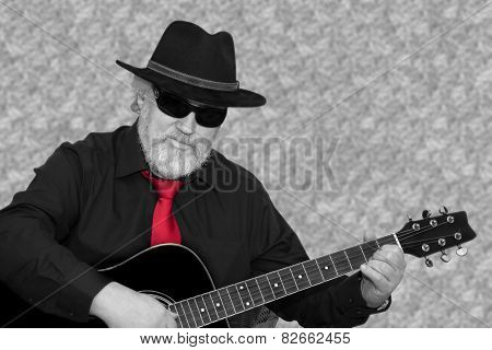 Senior is playing the guitar